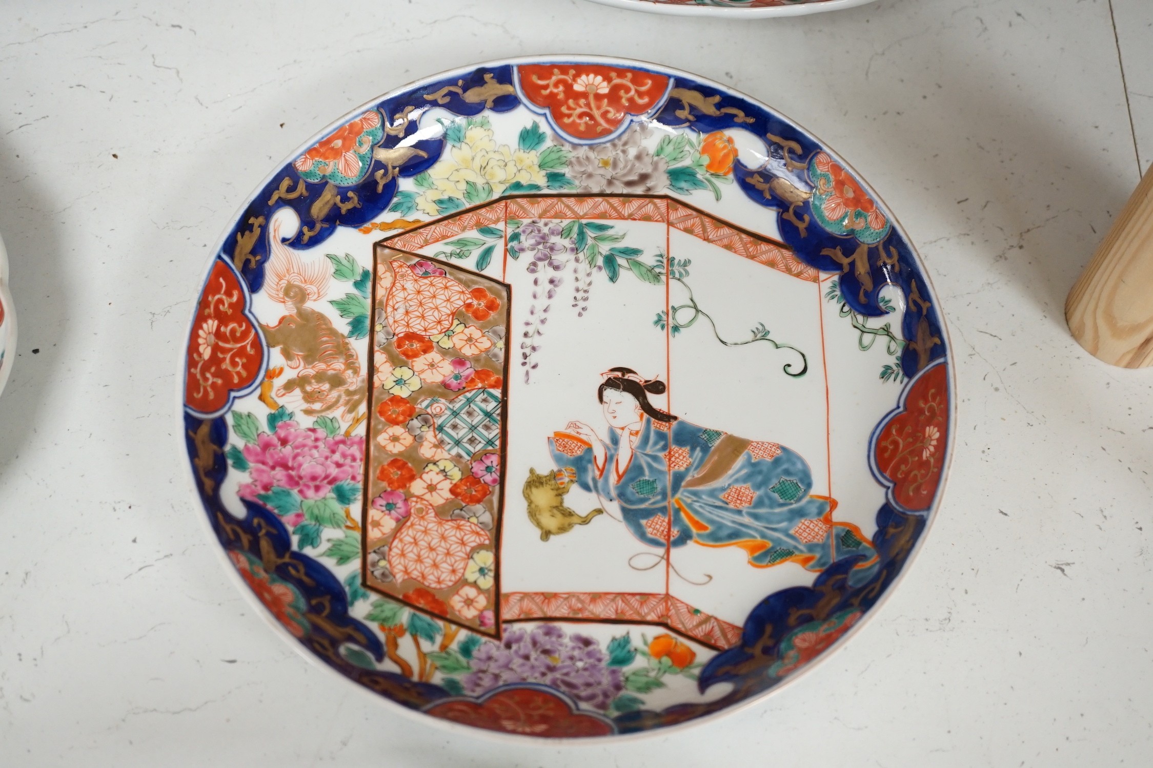 A group of 19th/20th century Japanese porcelain and pottery dishes. Largest 33cm diameter